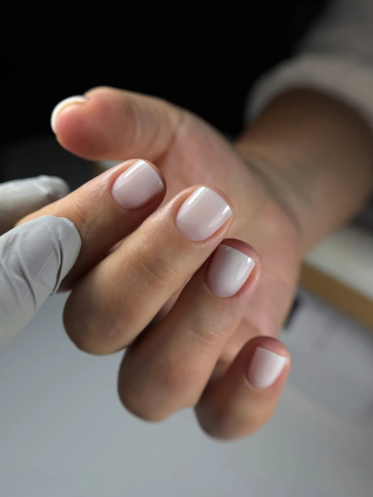 Short square nails in sheer milky-white gel, Russian manicure