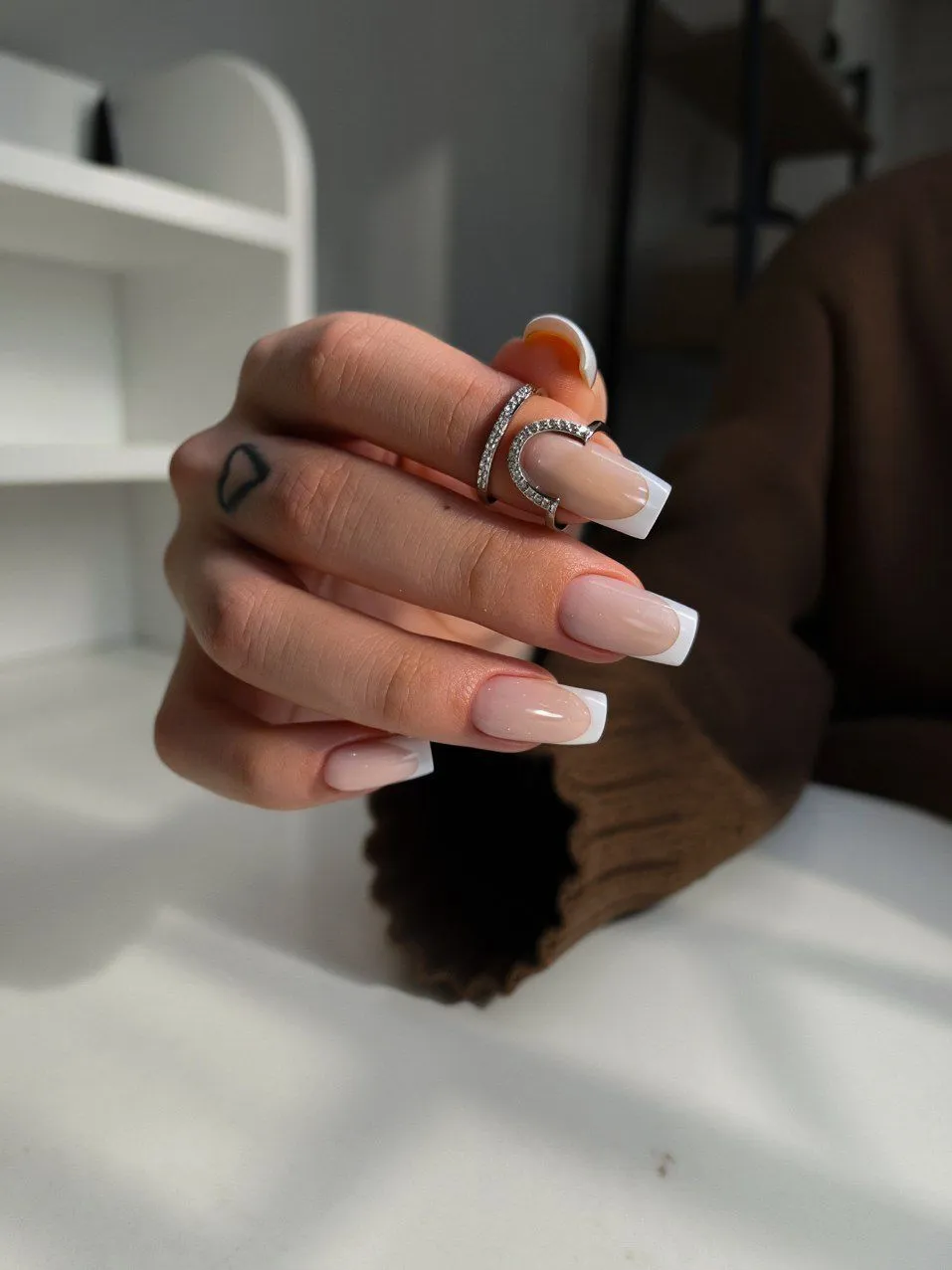 Long square gel extensions with a classic white French tip